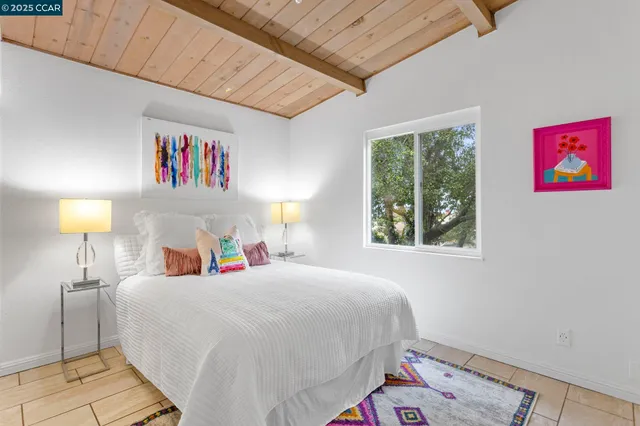 a bedroom with a bed and a lamp