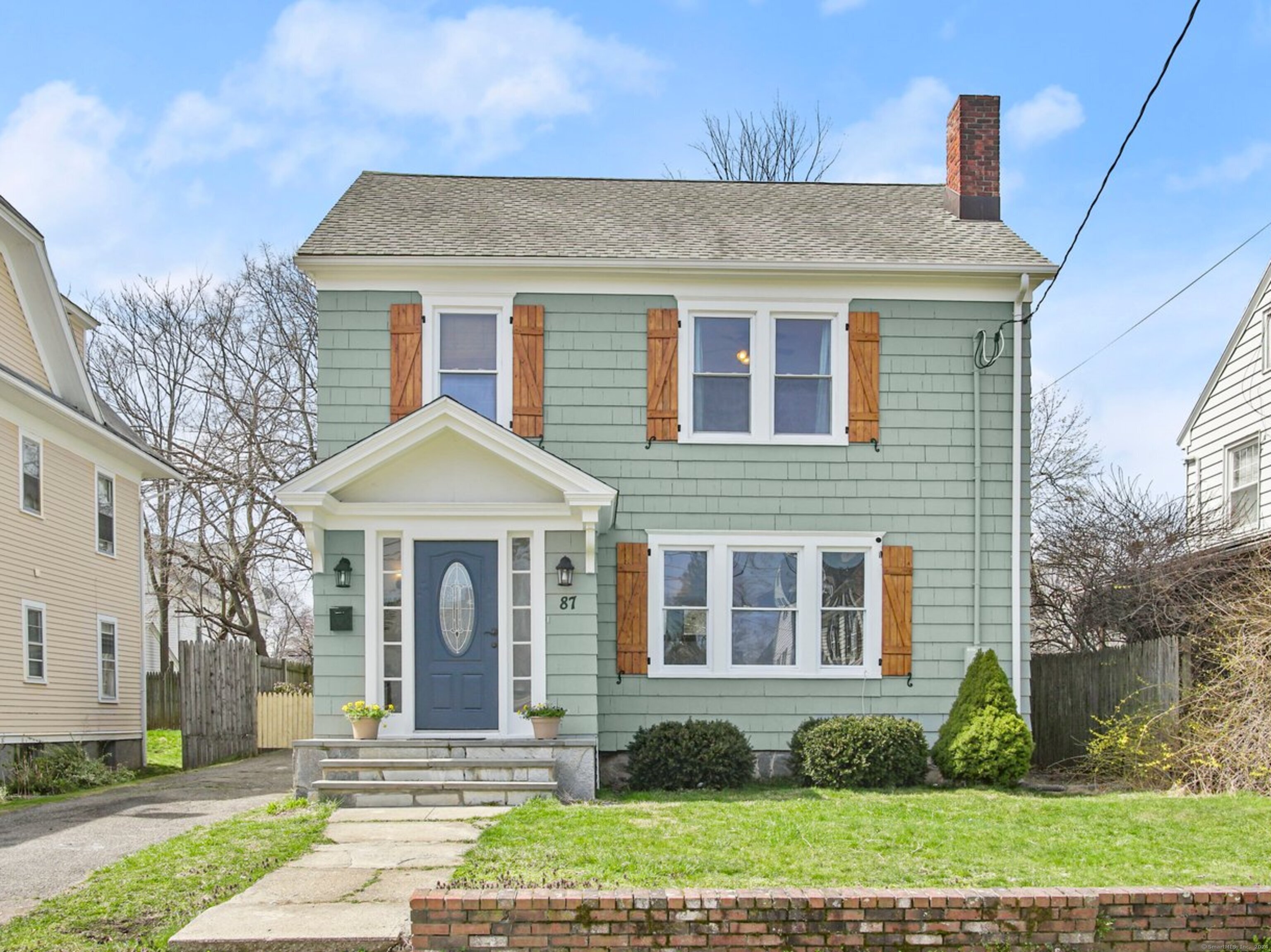 87 Calvin Avenue Bridgeport, CT 06604 - Photo 1 of 1 a front view of a house with a yard