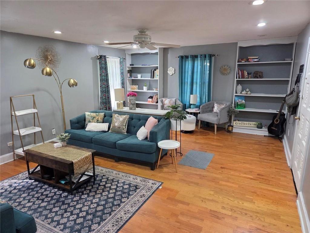3790 Mauck Street Clarkston, GA 30021 - Photo 7 of 26 a living room with furniture a rug and a table