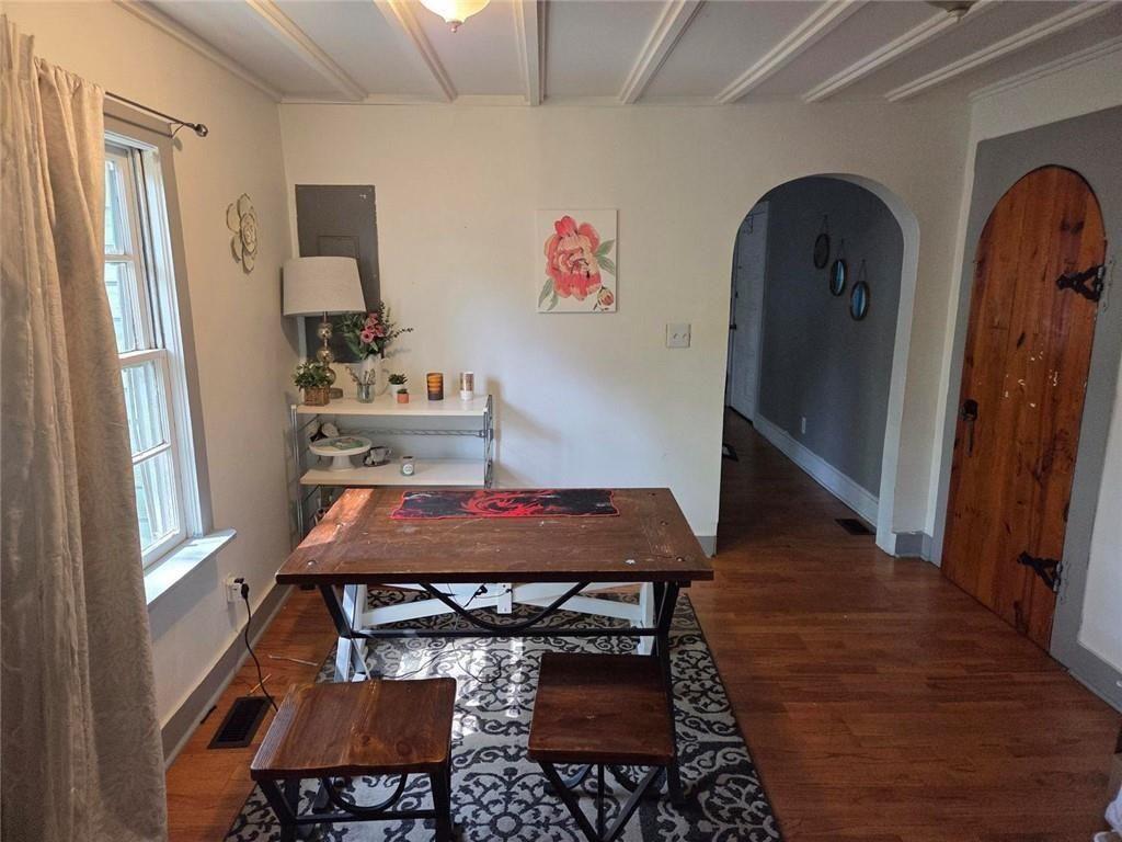 3790 Mauck Street Clarkston, GA 30021 - Photo 10 of 26 a view of a dining room with furniture and wooden floor