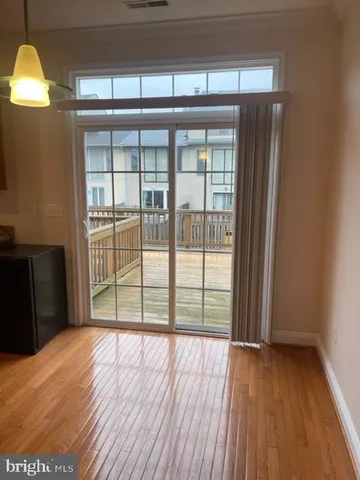 a view of a hallway with a door