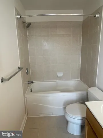 a view of a garden with a building in the background