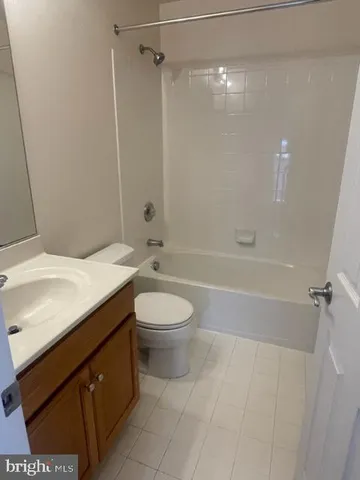 a view of staircase with white walls