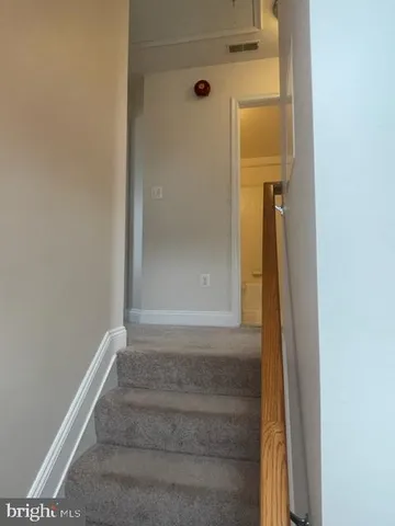 a view of a street with a house