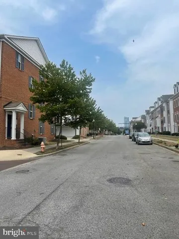 a view of street with parked cars