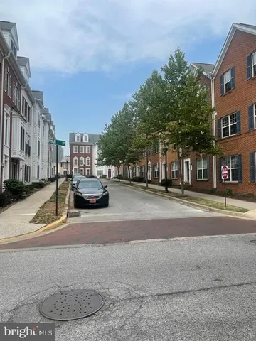 a view of street with cars parked
