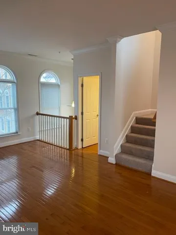 a kitchen with stainless steel appliances granite countertop a refrigerator a sink dishwasher a stove top oven and a refrigerator