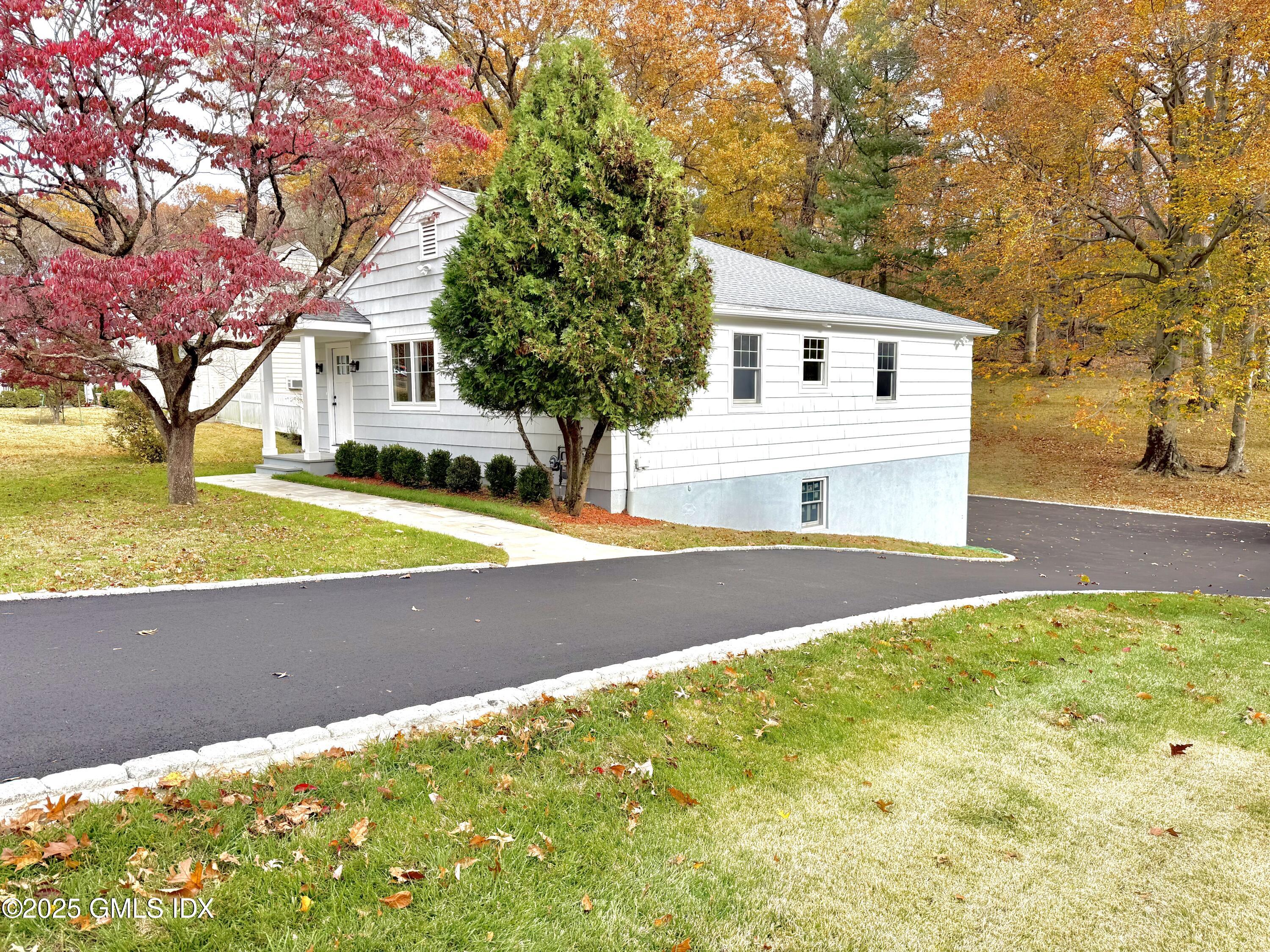 79 Laddins Rock Road Old Greenwich, CT 06870 - Photo 2 of 26 a view of outdoor space yard and swimming pool