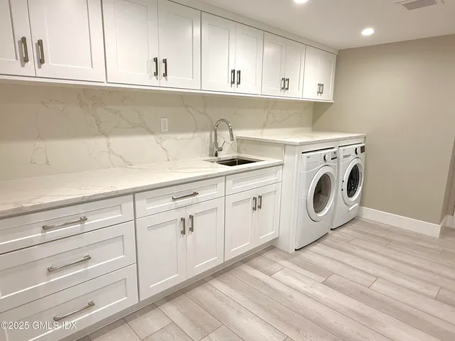 a utility room with dryer and washer