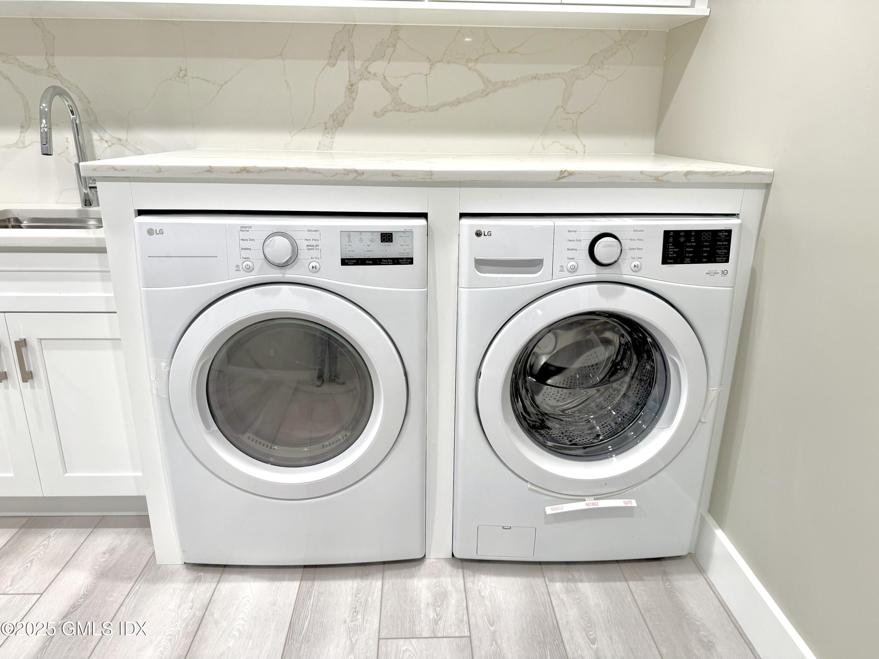 79 Laddins Rock Road Old Greenwich, CT 06870 - Photo 24 of 26 a utility room with dryer and washer