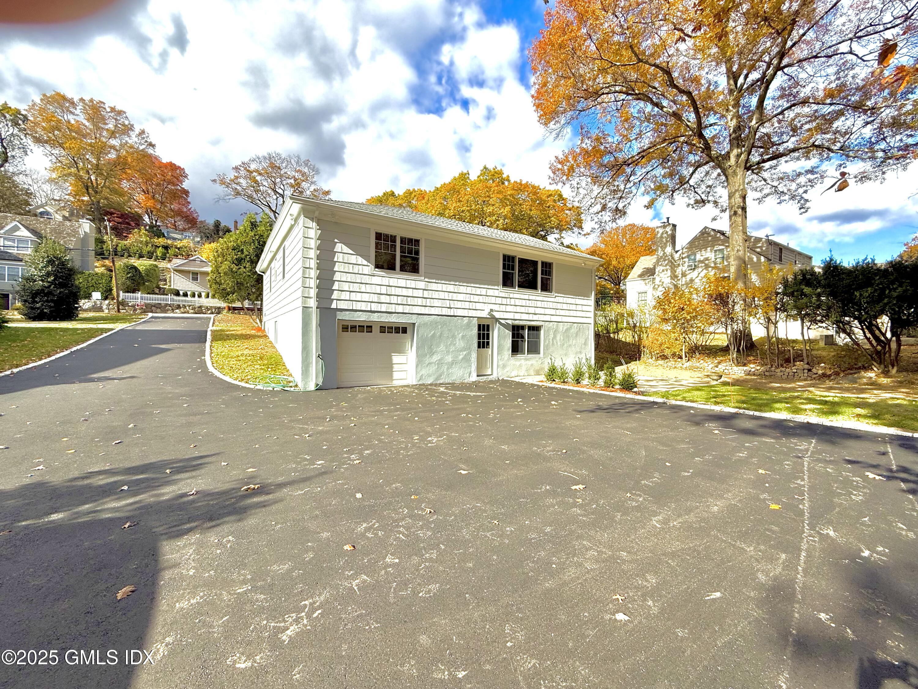 79 Laddins Rock Road Old Greenwich, CT 06870 - Photo 25 of 26 a view of a street with houses
