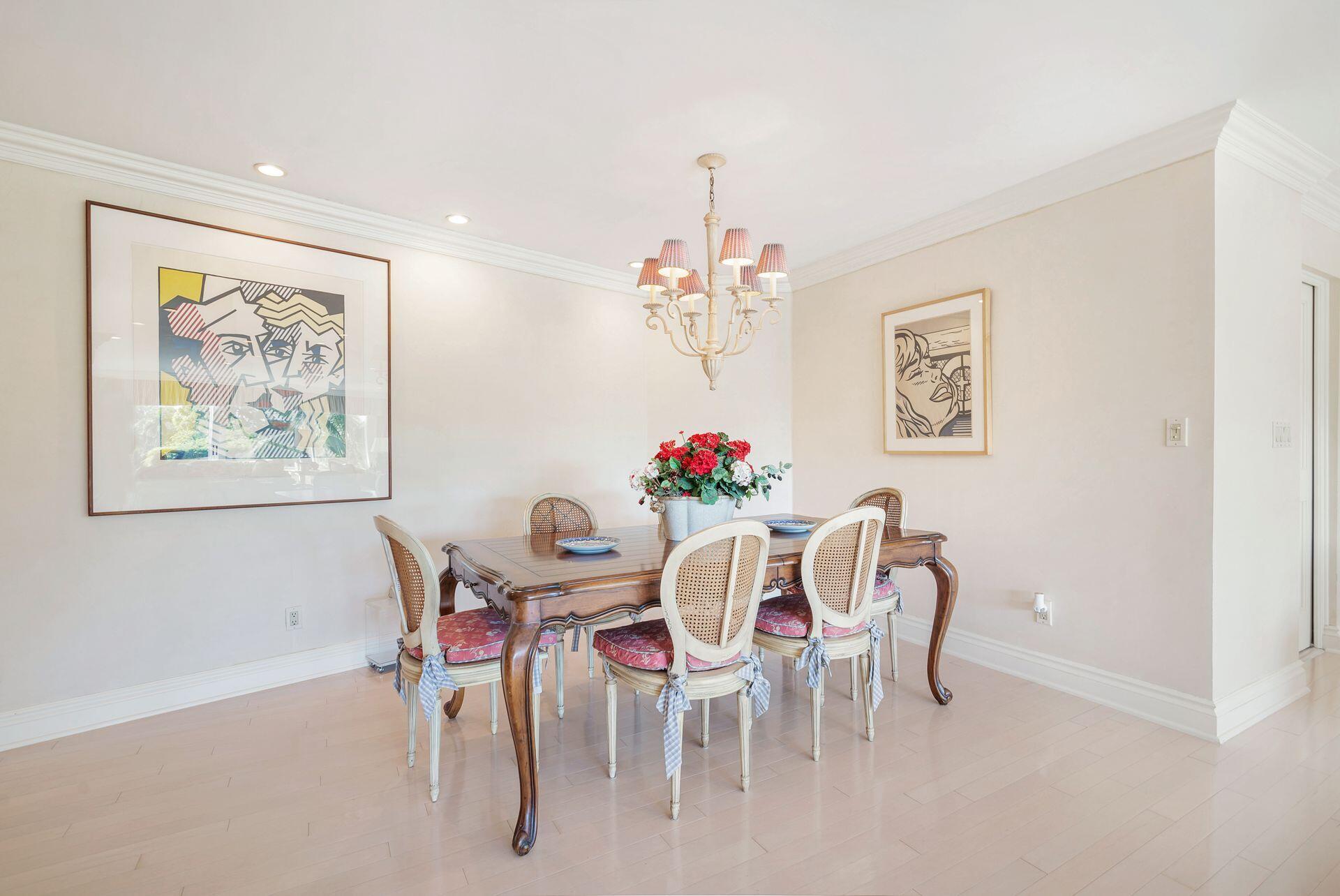 44 Cocoanut Row, Unit 227B Palm Beach, FL 33480 - Photo 9 of 28 a view of a dining room with furniture and a chandelier
