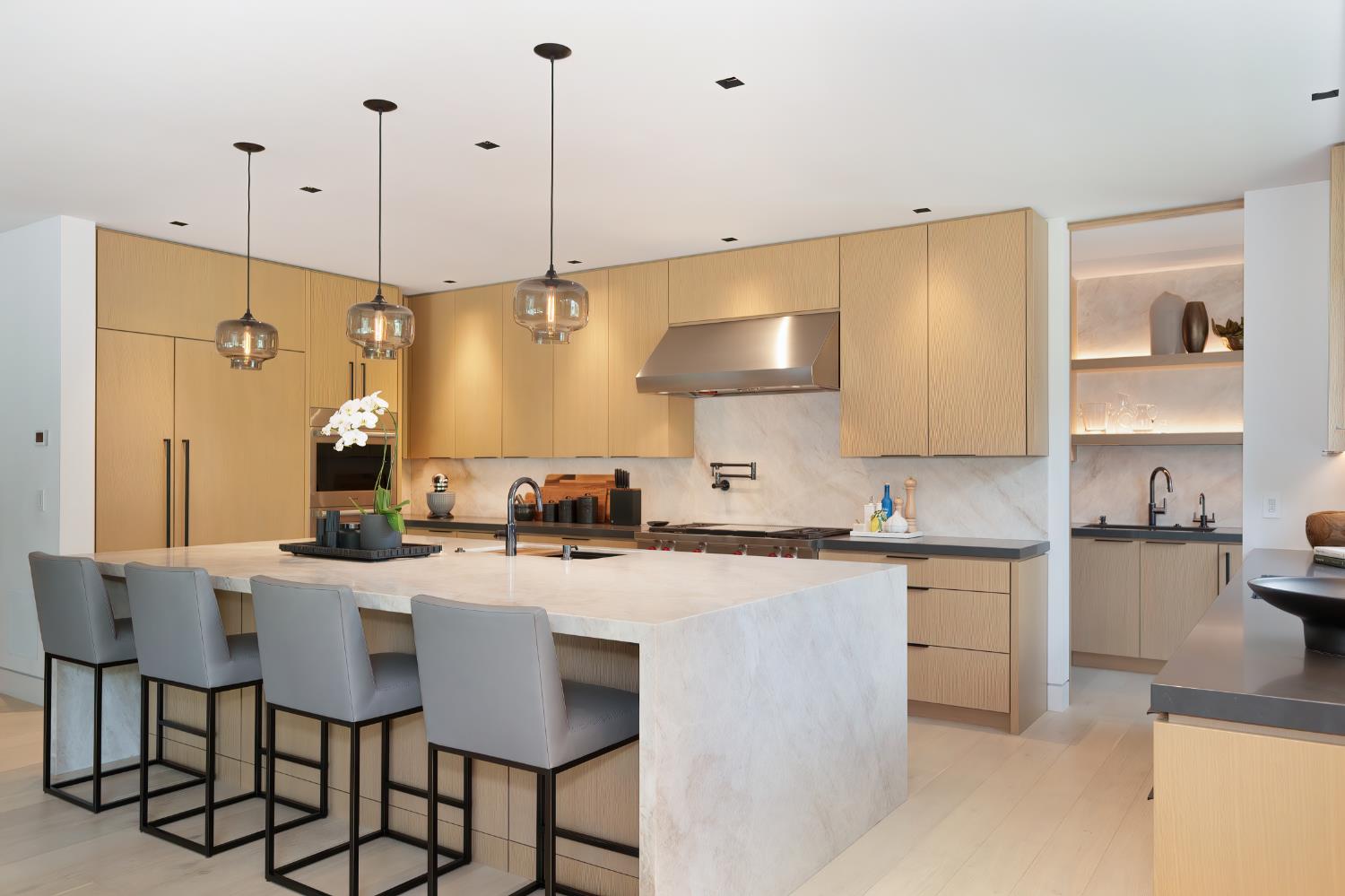 5020 Manchester Court Granite Bay, CA 95746 - Photo 27 of 95 a kitchen with stainless steel appliances granite countertop a sink a stove a refrigerator a microwave oven and a dining table with wooden floor
