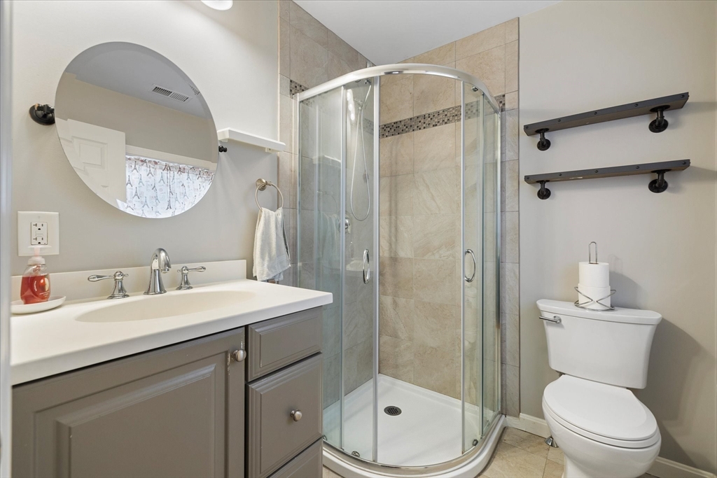 113 Baldwinville Road Templeton, MA 01468 - Photo 12 of 24 a bathroom with a toilet a sink a mirror and shower
