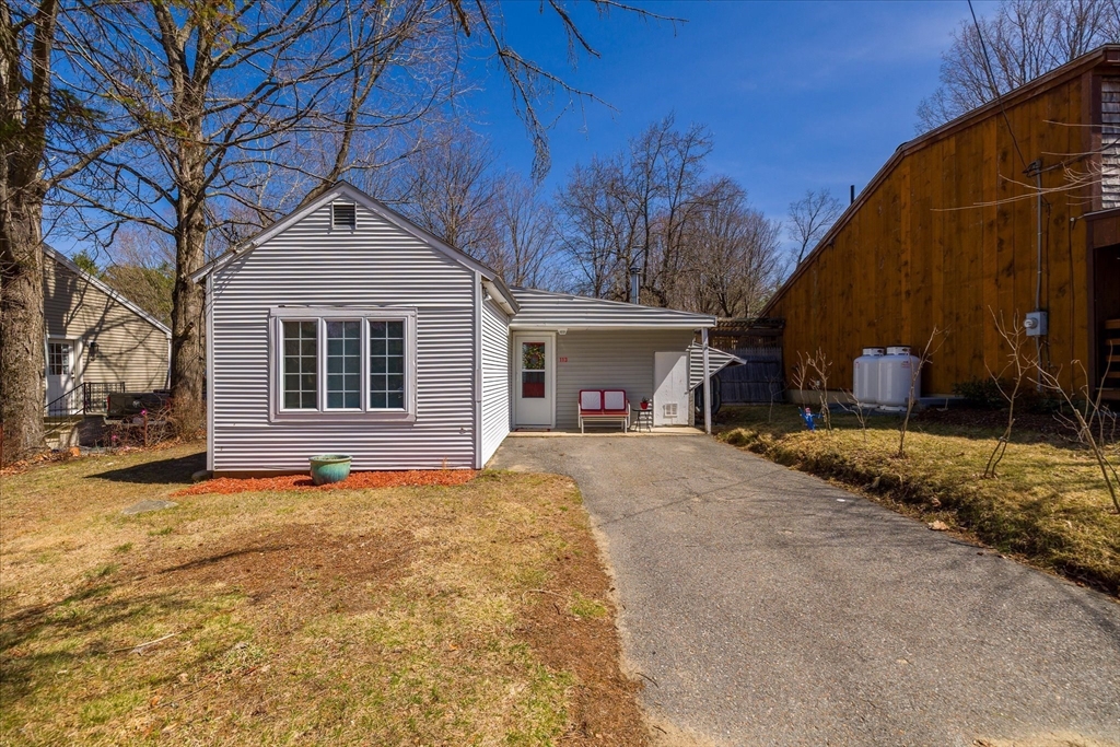 113 Baldwinville Road Templeton, MA 01468 - Photo 2 of 24 a front view of a house with a yard and garage
