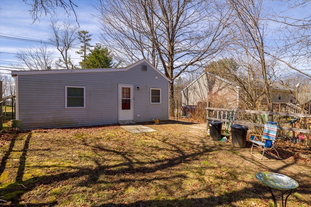 113 Baldwinville Road Templeton, MA 01468 - Photo 21 of 24 a backyard of a house with large trees and outdoor seating