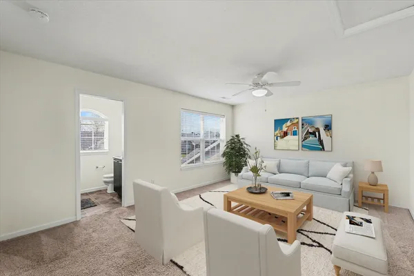 a living room with furniture and a table