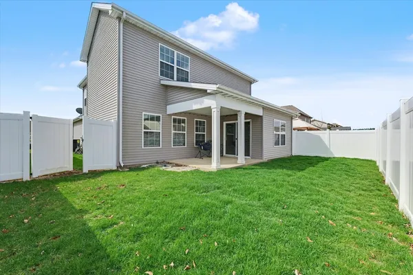a view of a back yard of the house