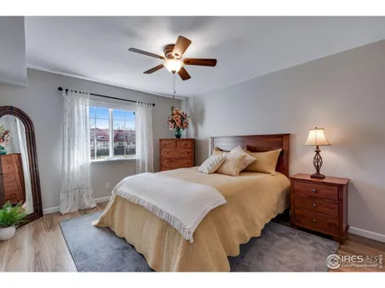 a bathroom with a sink a toilet a mirror and shower