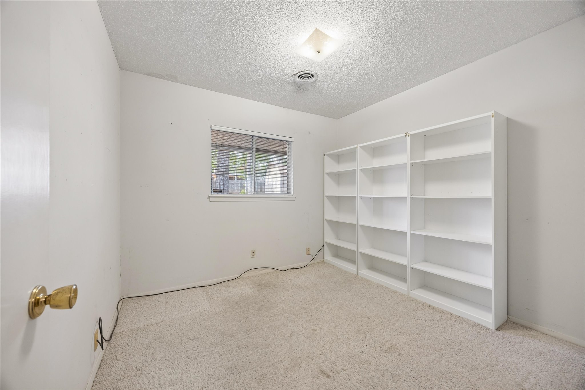 1815 Parkside Lane Austin, TX 78745 - Photo 12 of 28 a view of an empty room with a window