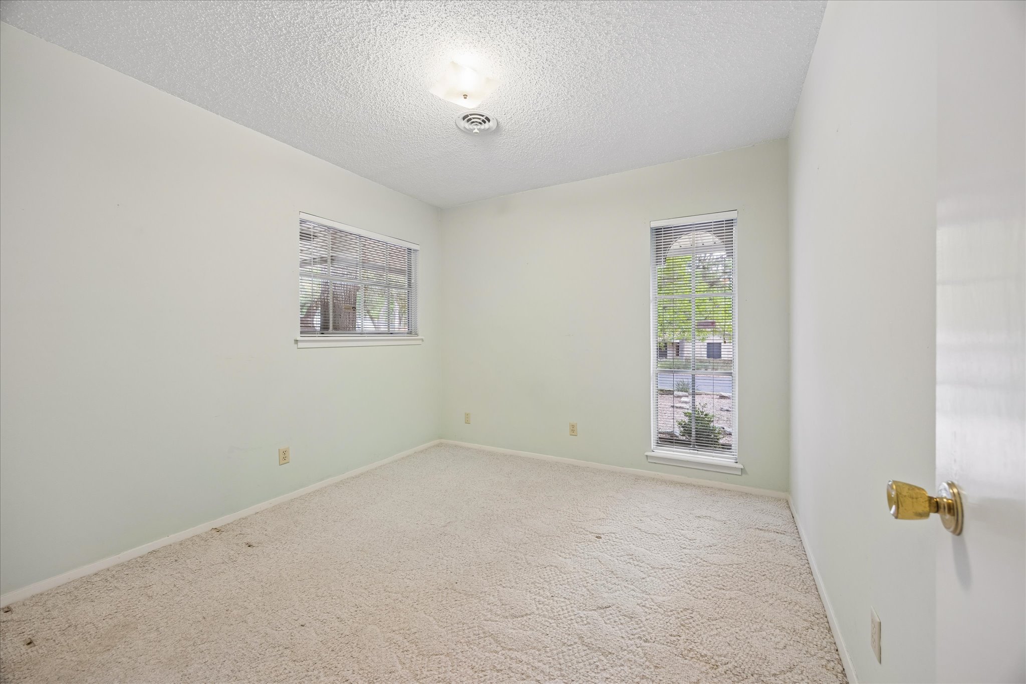 1815 Parkside Lane Austin, TX 78745 - Photo 13 of 28 an empty room with windows