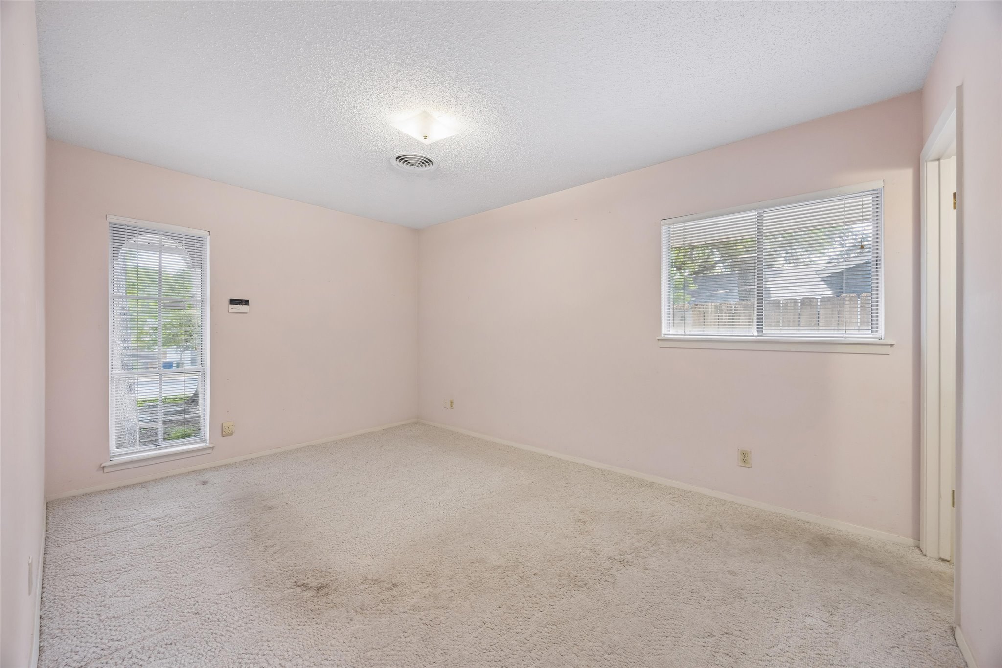 1815 Parkside Lane Austin, TX 78745 - Photo 14 of 28 an empty room with windows