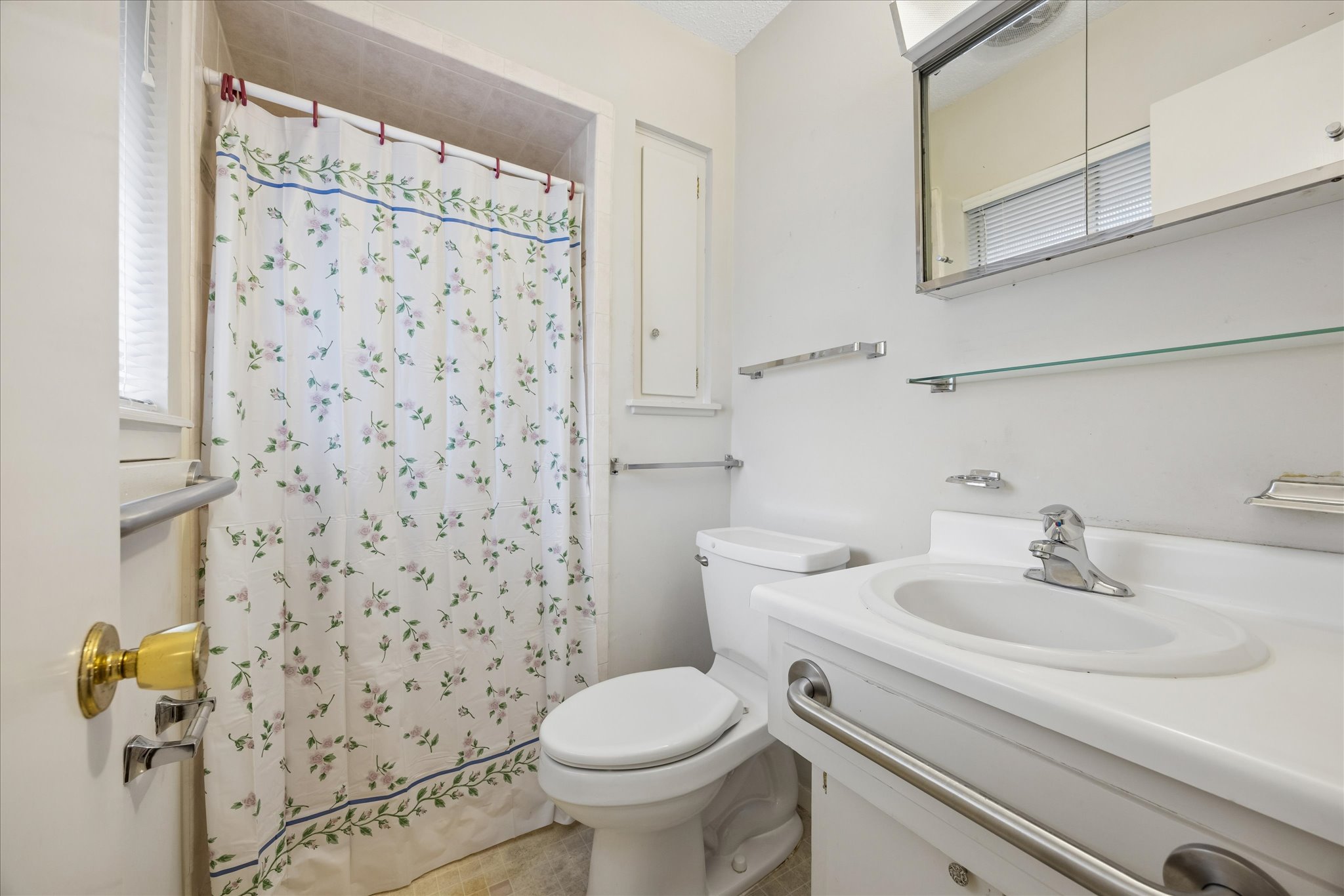 1815 Parkside Lane Austin, TX 78745 - Photo 16 of 28 a bathroom with a sink toilet and shower