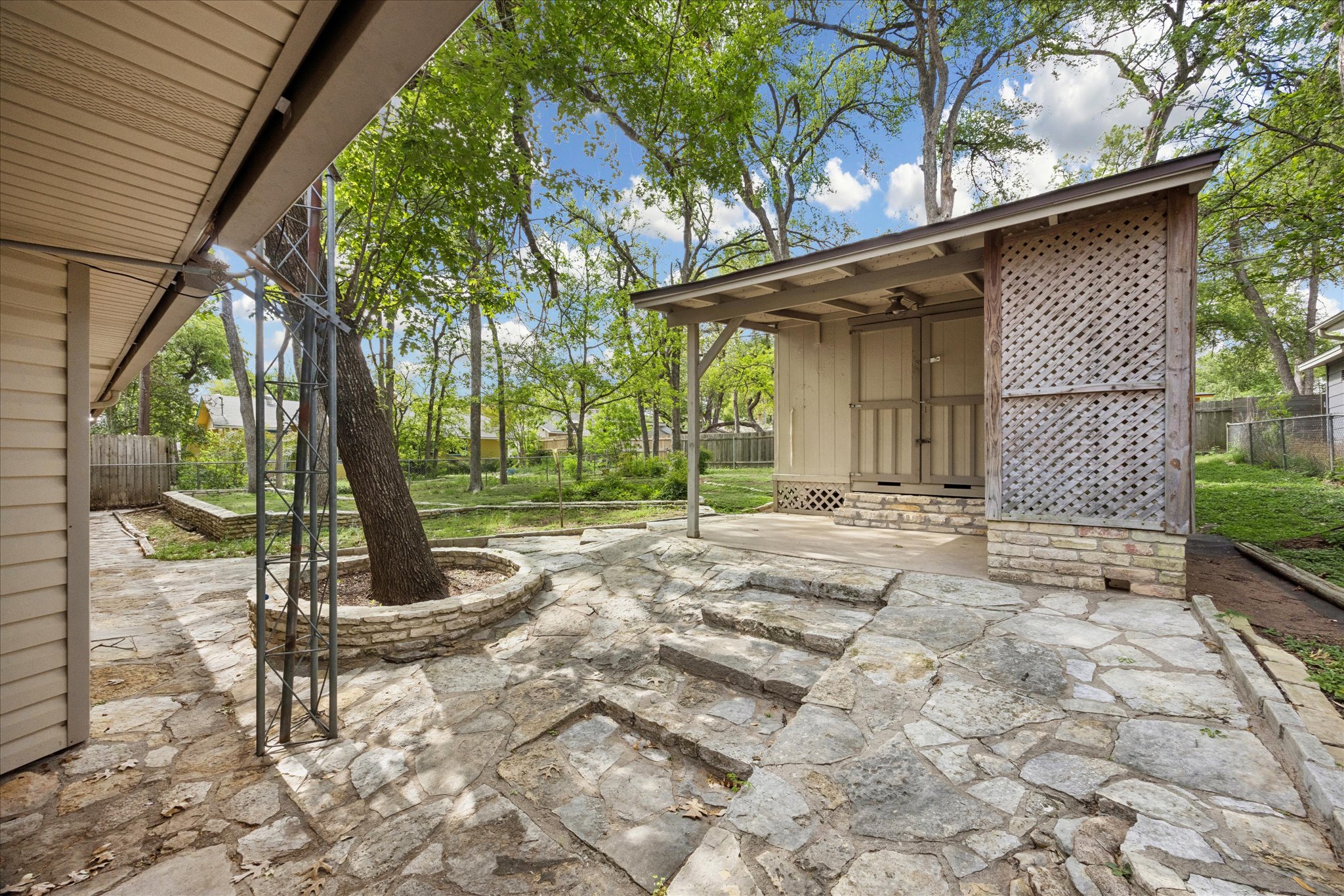 1815 Parkside Lane Austin, TX 78745 - Photo 19 of 28 a view of a backyard with a tree