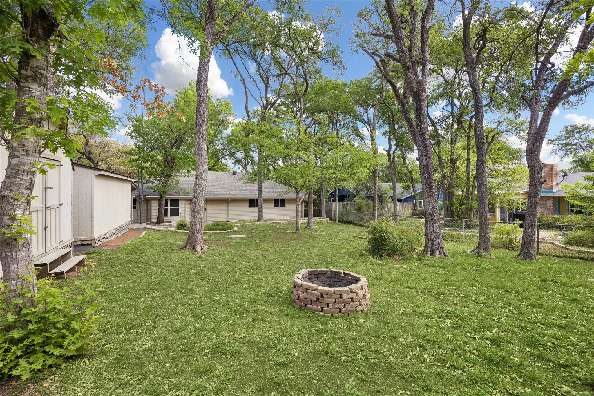 1815 Parkside Lane Austin, TX 78745 - Photo 2 of 28 a view of a backyard with a garden