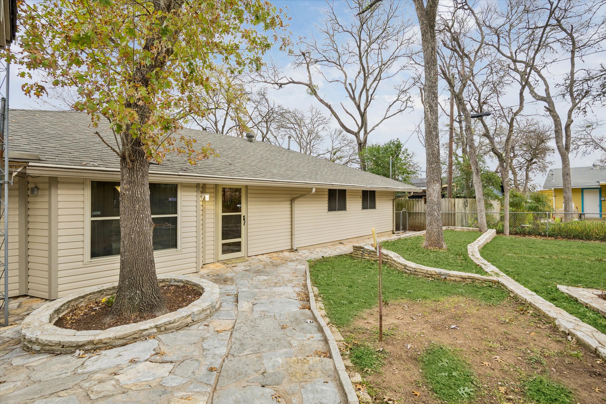 1815 Parkside Lane Austin, TX 78745 - Photo 22 of 28 a front view of a house with garden