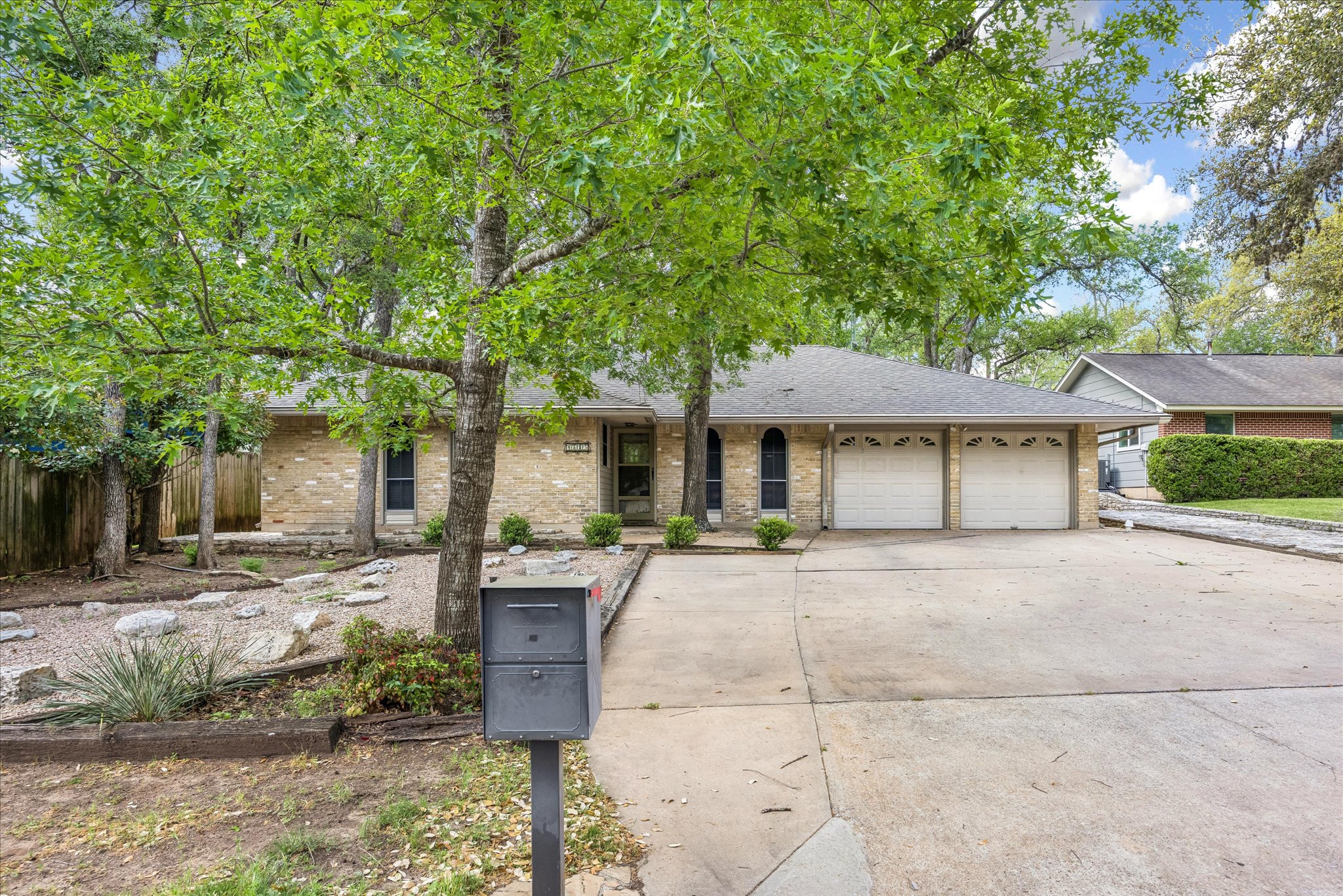 1815 Parkside Lane Austin, TX 78745 - Photo 27 of 28 a front view of a house with garden