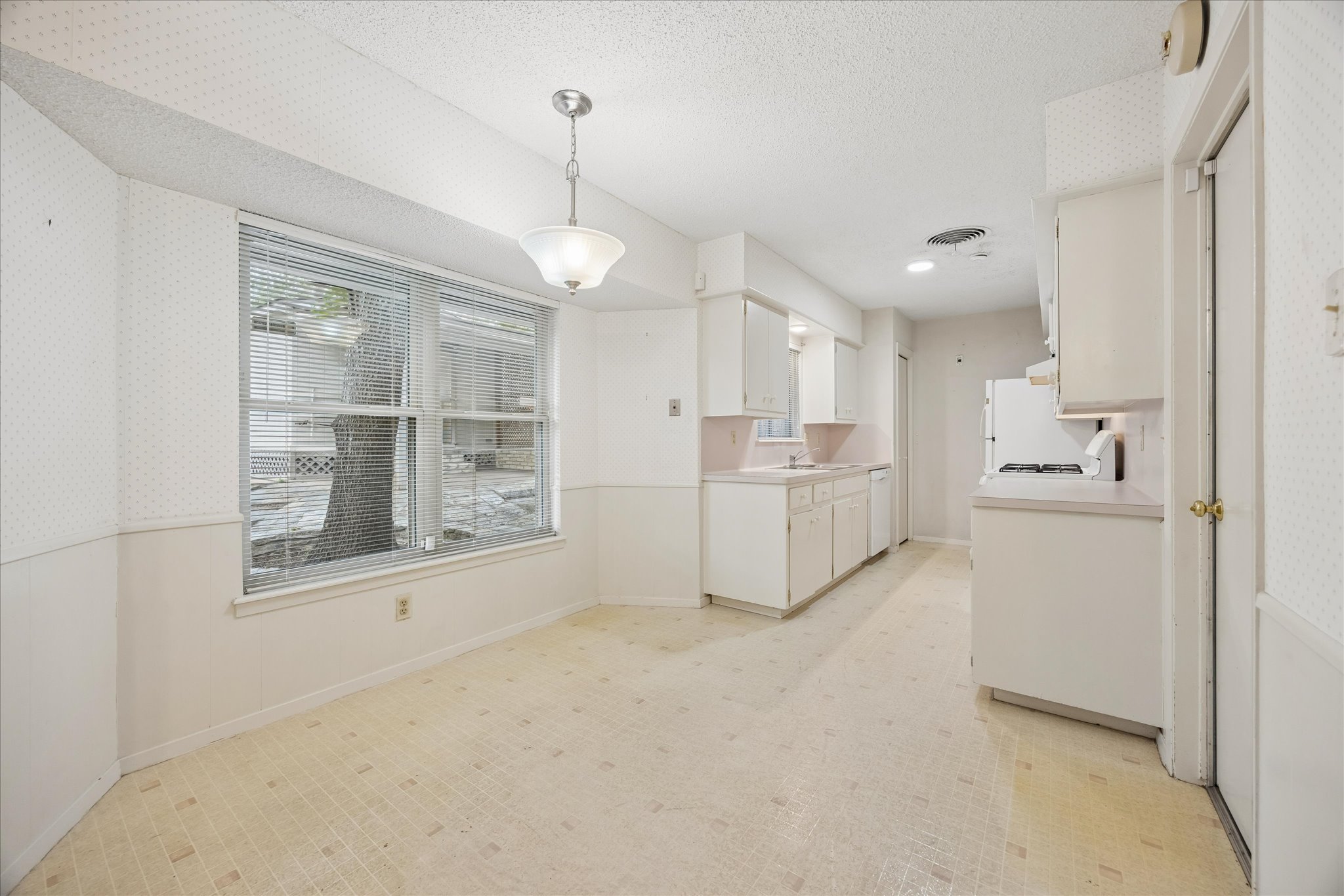 1815 Parkside Lane Austin, TX 78745 - Photo 7 of 28 a view of a kitchen with a sink cabinets and window
