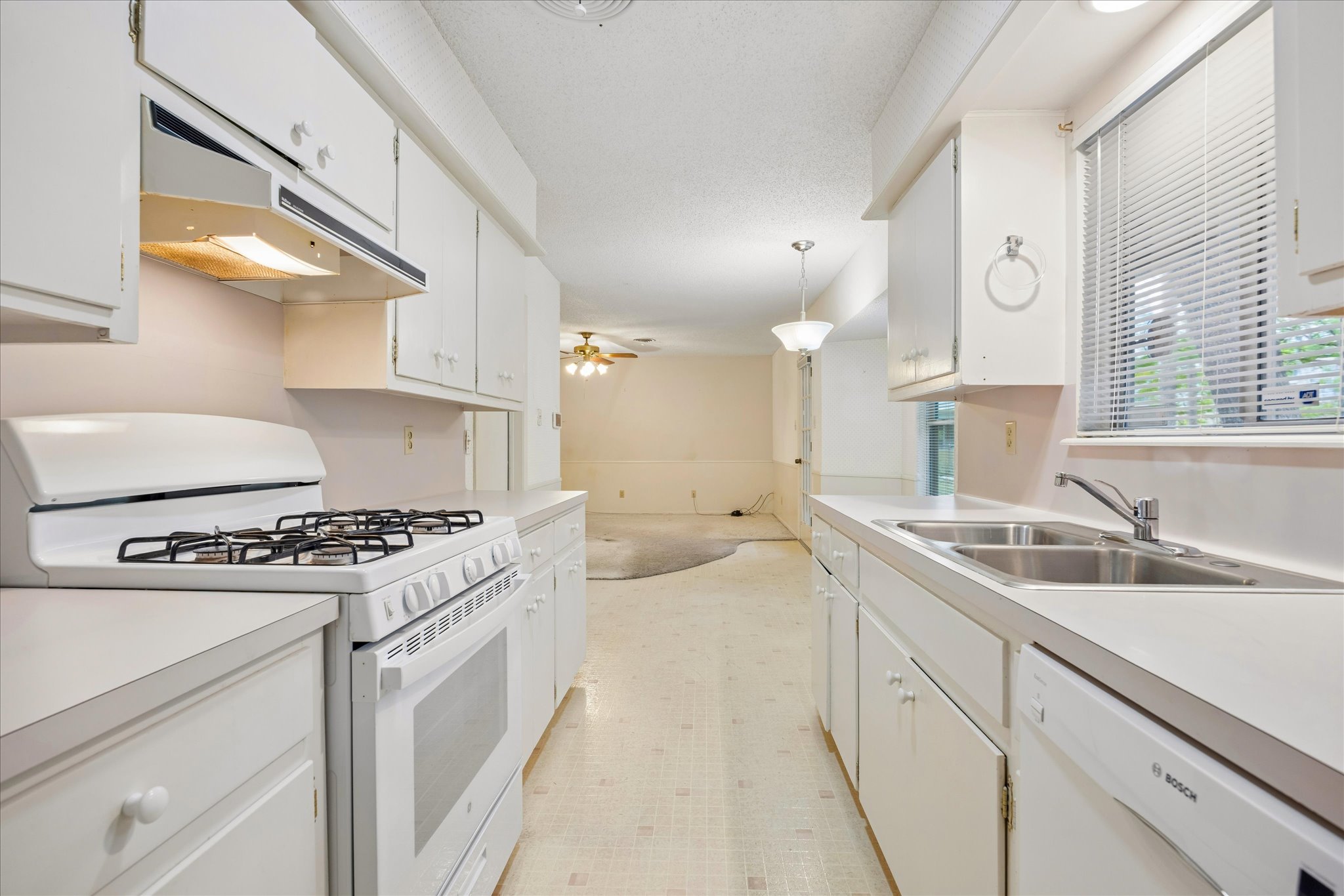 1815 Parkside Lane Austin, TX 78745 - Photo 9 of 28 a kitchen with a sink stove and cabinets