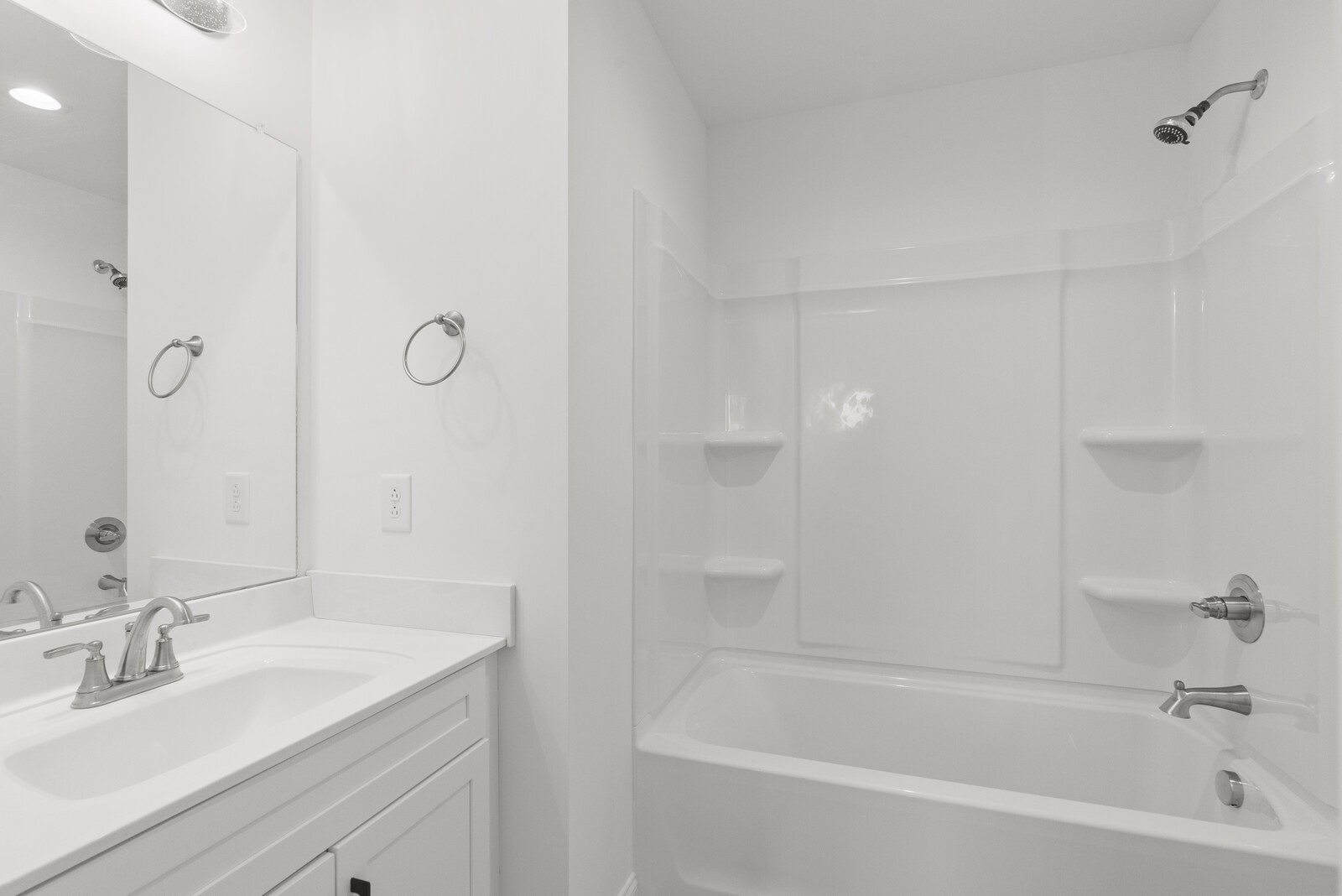 106 North Walnut Street Springfield, TN 37172 - Photo 11 of 14 a bathroom with a granite countertop sink a mirror and a bathtub
