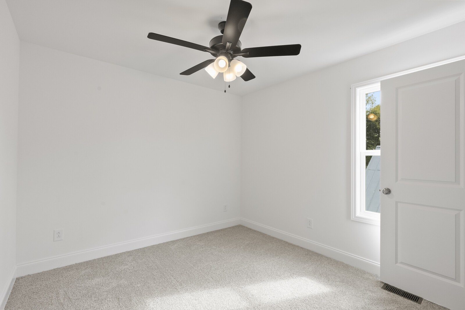 106 North Walnut Street Springfield, TN 37172 - Photo 12 of 14 an empty room with a window and a fan