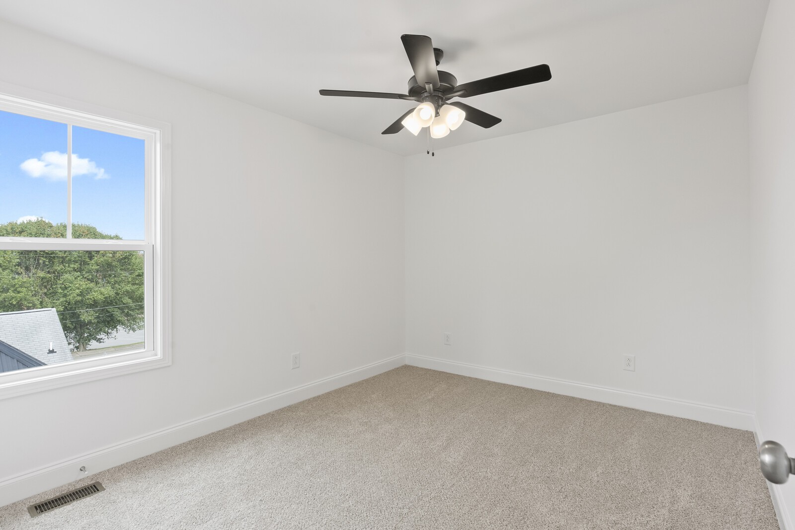 106 North Walnut Street Springfield, TN 37172 - Photo 13 of 14 an empty room with a window and a fan