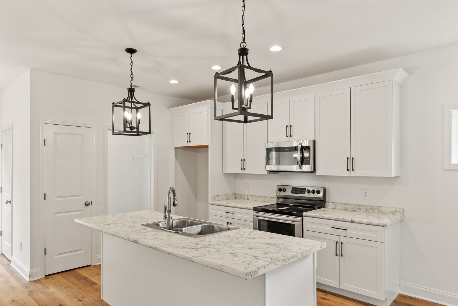 106 North Walnut Street Springfield, TN 37172 - Photo 5 of 14 a kitchen with stainless steel appliances granite countertop a sink a stove a refrigerator and white cabinets