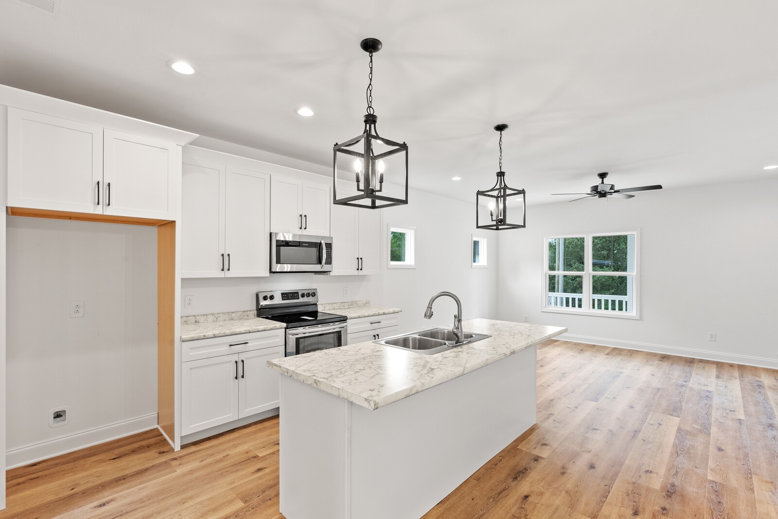 106 North Walnut Street Springfield, TN 37172 - Photo 6 of 14 a kitchen with a sink stove and wooden floor