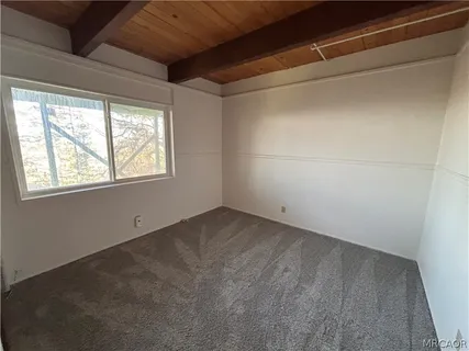 a kitchen with white cabinets a sink dishwasher and a stove top oven