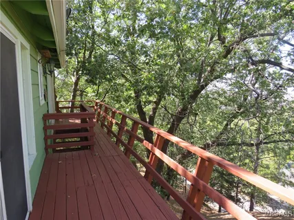 a view of balcony with wooden floor