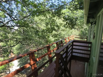 a view of stairs and wooden floor