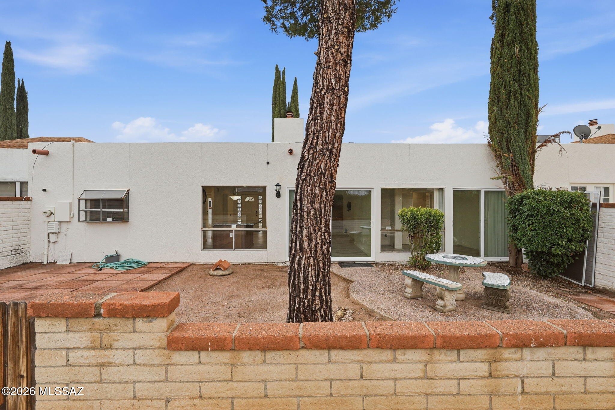 1183 Circulo Canario Rio Rico, AZ 85648 - Photo 25 of 31 a front view of a house with garden and porch