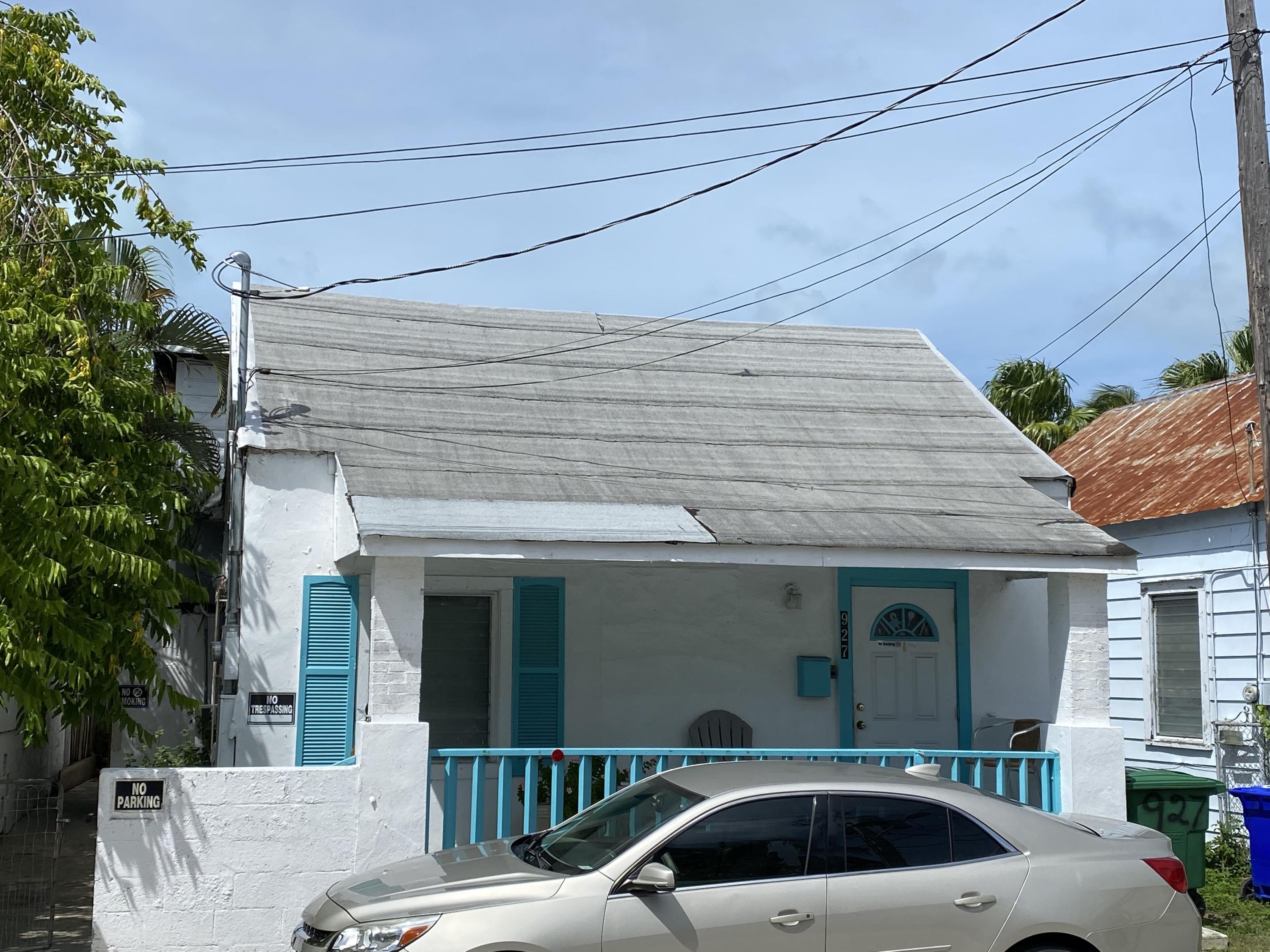 927 Catherine Street Key West, FL 33040 - Photo 2 of 29 a couple of cars parked in front of a house