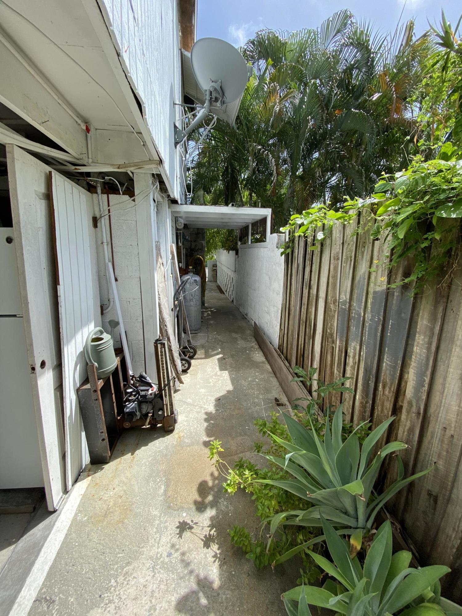 927 Catherine Street Key West, FL 33040 - Photo 15 of 29 a view of a garage with plants