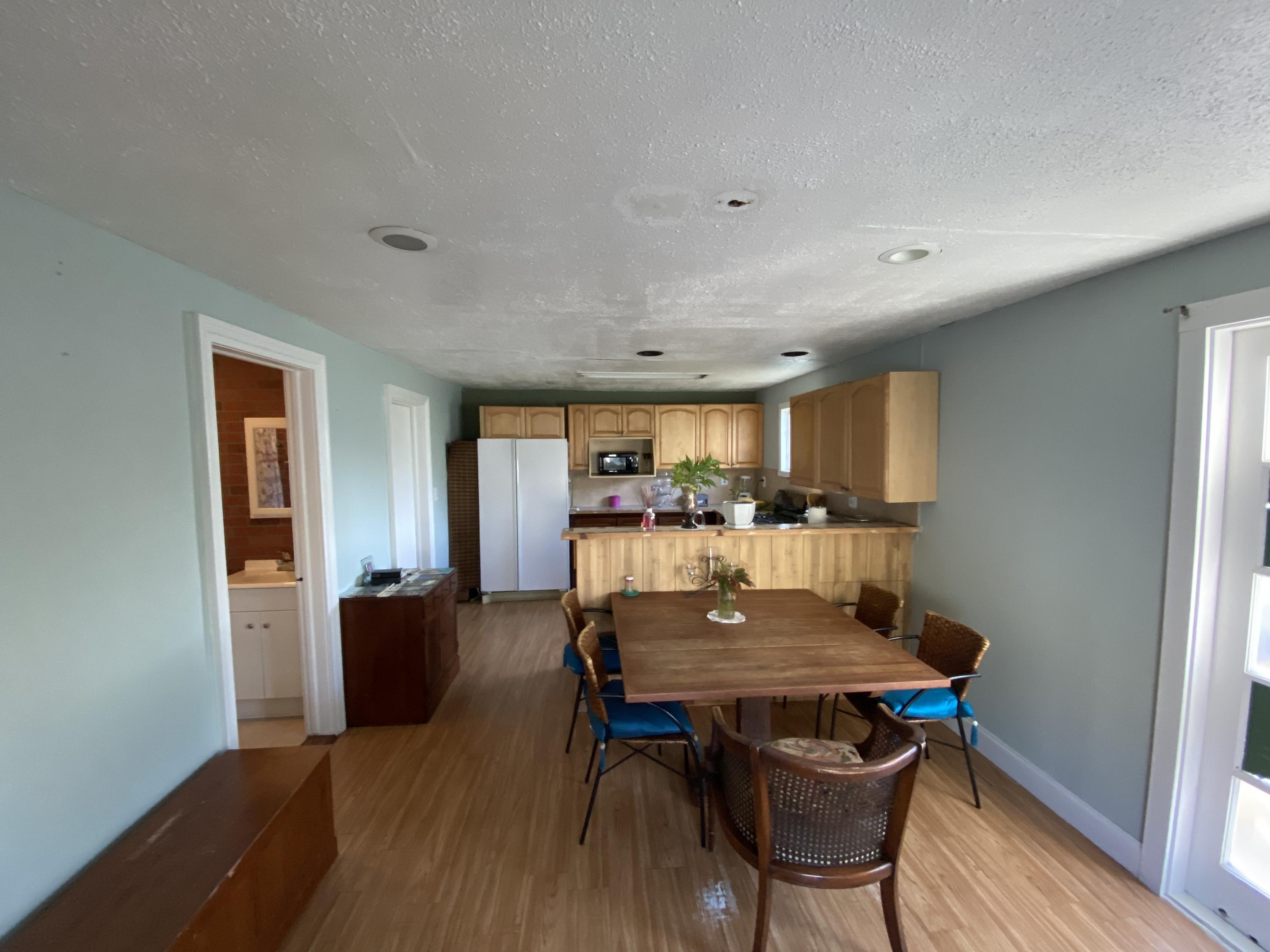 927 Catherine Street Key West, FL 33040 - Photo 17 of 29 a view of a dining room with furniture and wooden floor