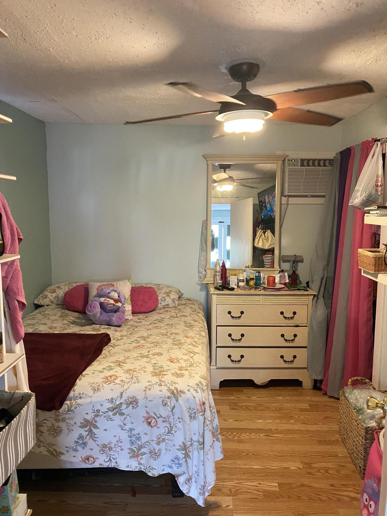 927 Catherine Street Key West, FL 33040 - Photo 26 of 29 a bedroom with a bed and a mirror