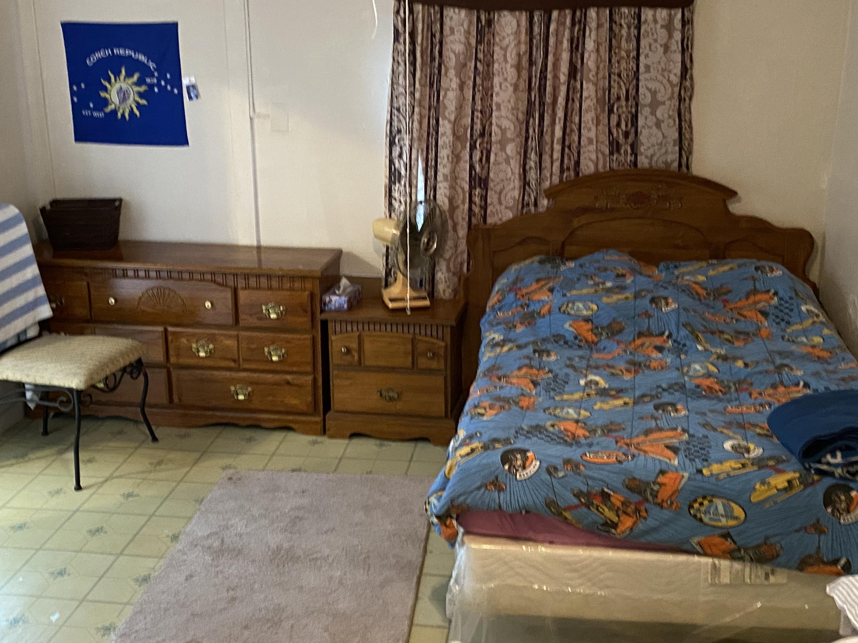 927 Catherine Street Key West, FL 33040 - Photo 8 of 29 a bedroom with a bed and a painting on the wall