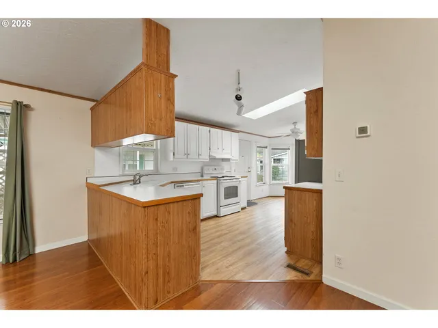 a kitchen with sink and cabinets