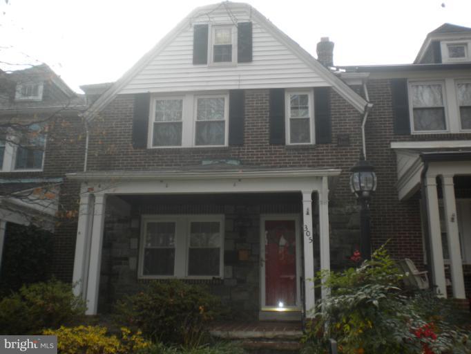305 Hopkins Road Baltimore, MD 21212 - Photo 1 of 30 a front view of a house with plants