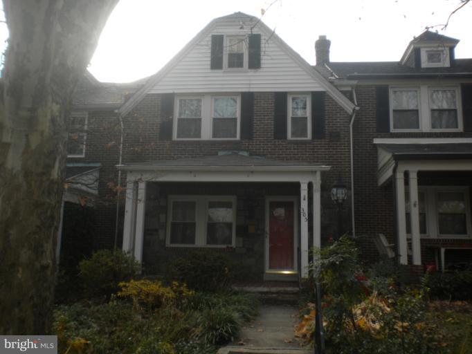 305 Hopkins Road Baltimore, MD 21212 - Photo 2 of 30 a brick house with small yard and plants